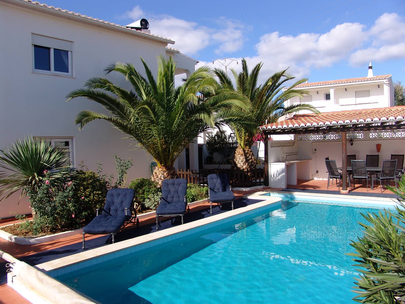 The pool and outdoor dining area