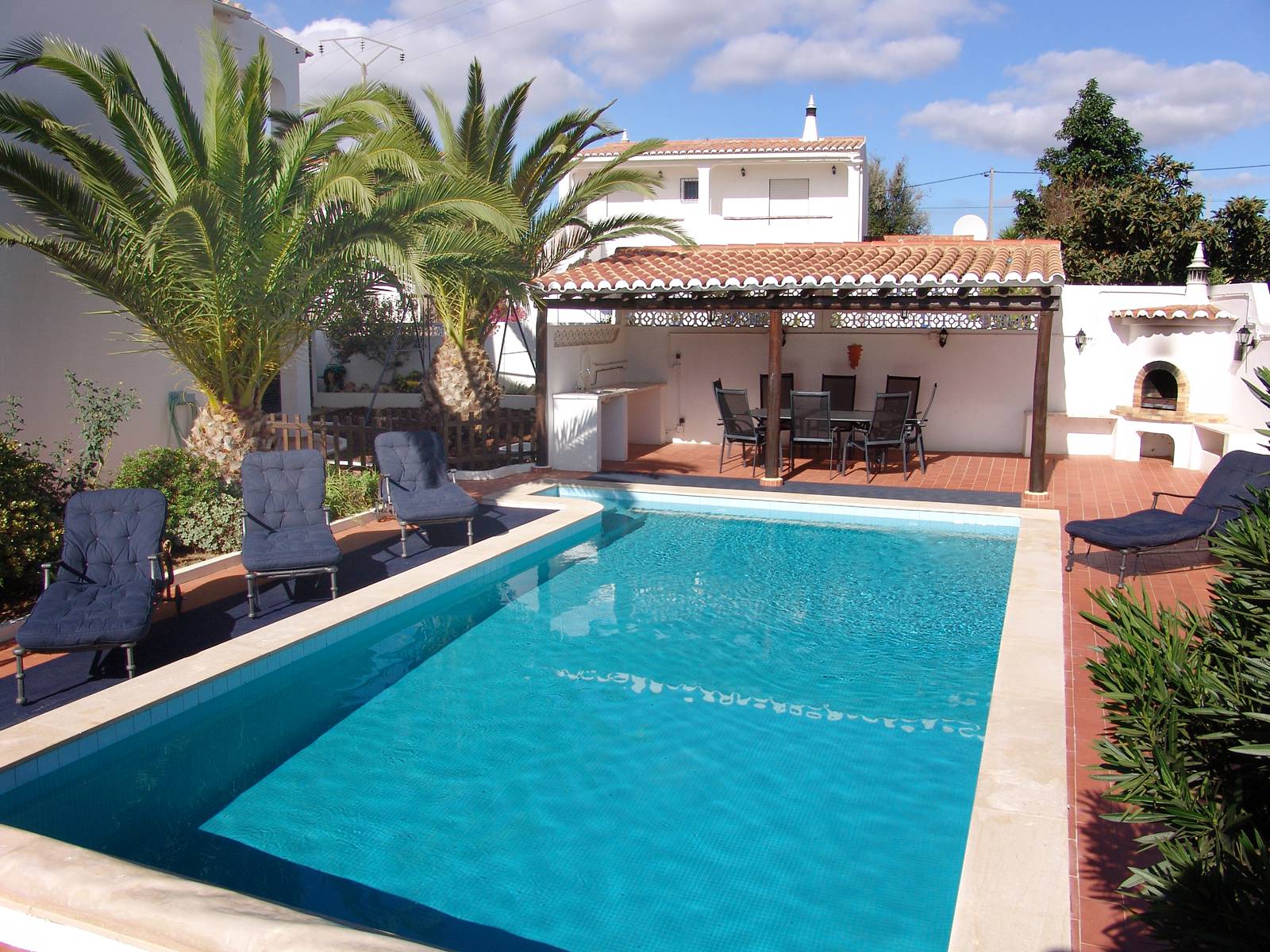 The pool and outdoor dining area