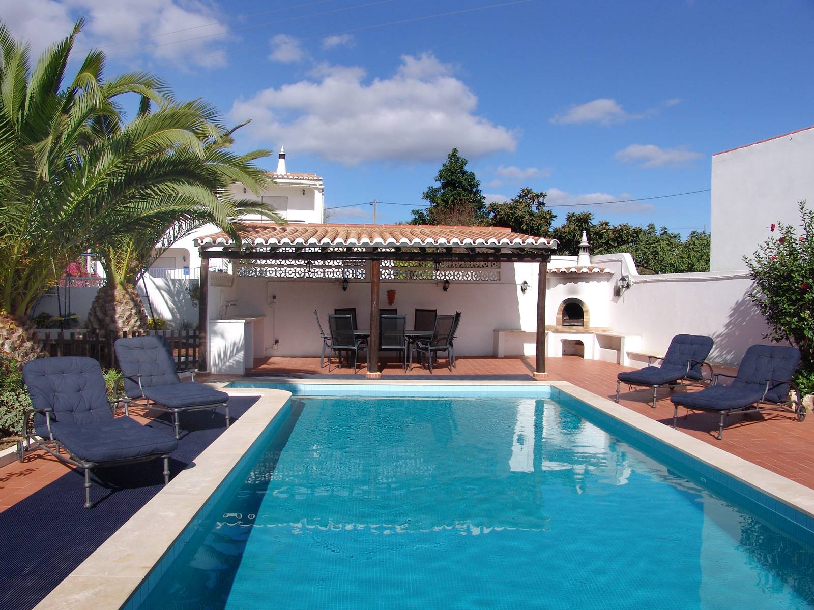 The pool and outdoor dining area