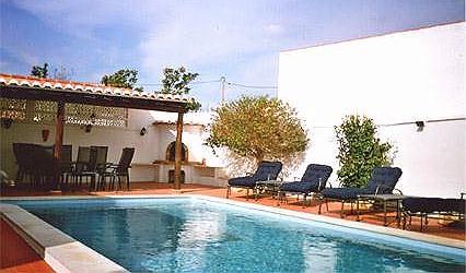 The pool and BBQ area of Casa Sandra